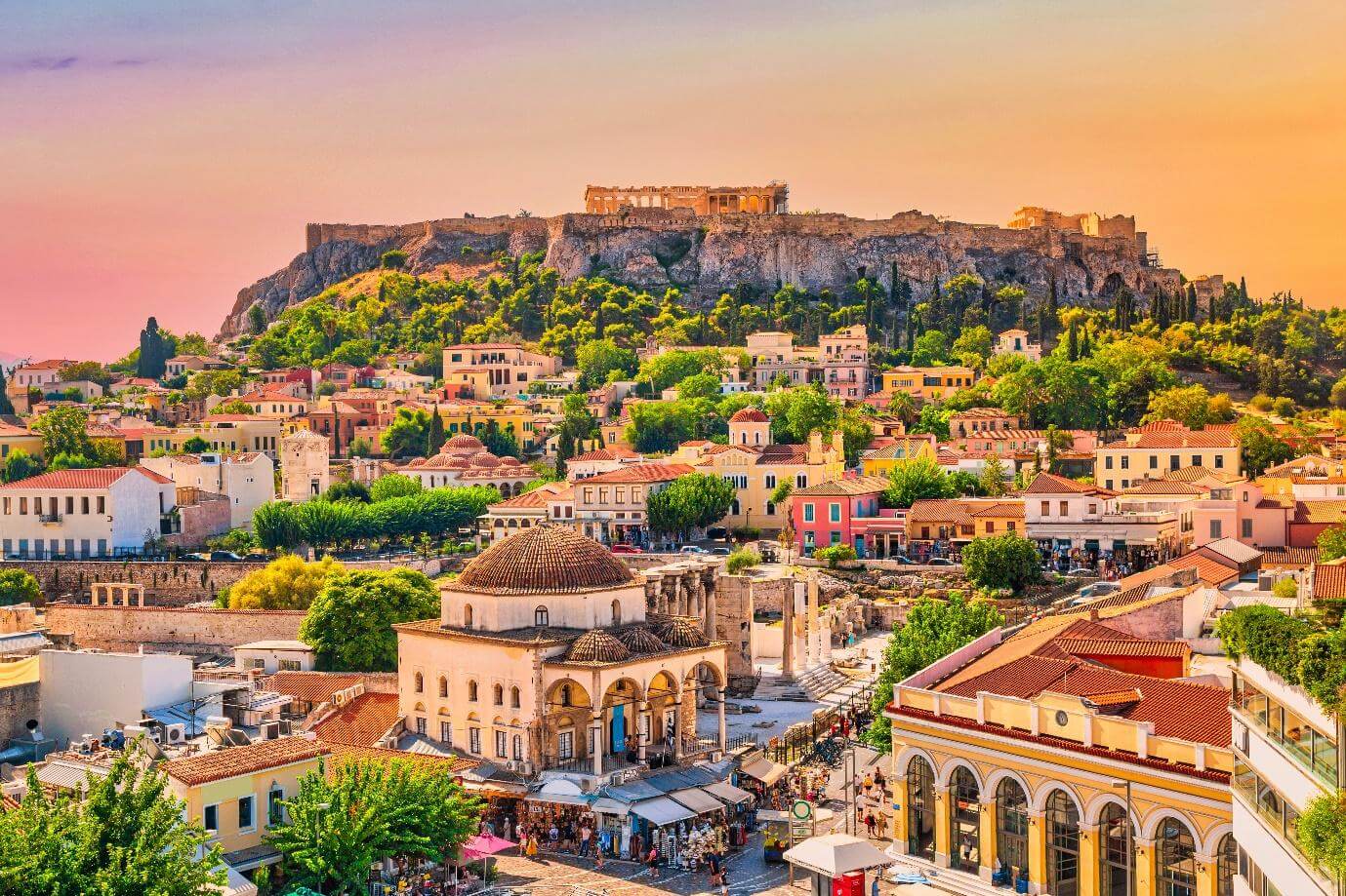 Skyline of Athens with Monastiraki square and Acropolis hill during sunset. Athens, Greece.